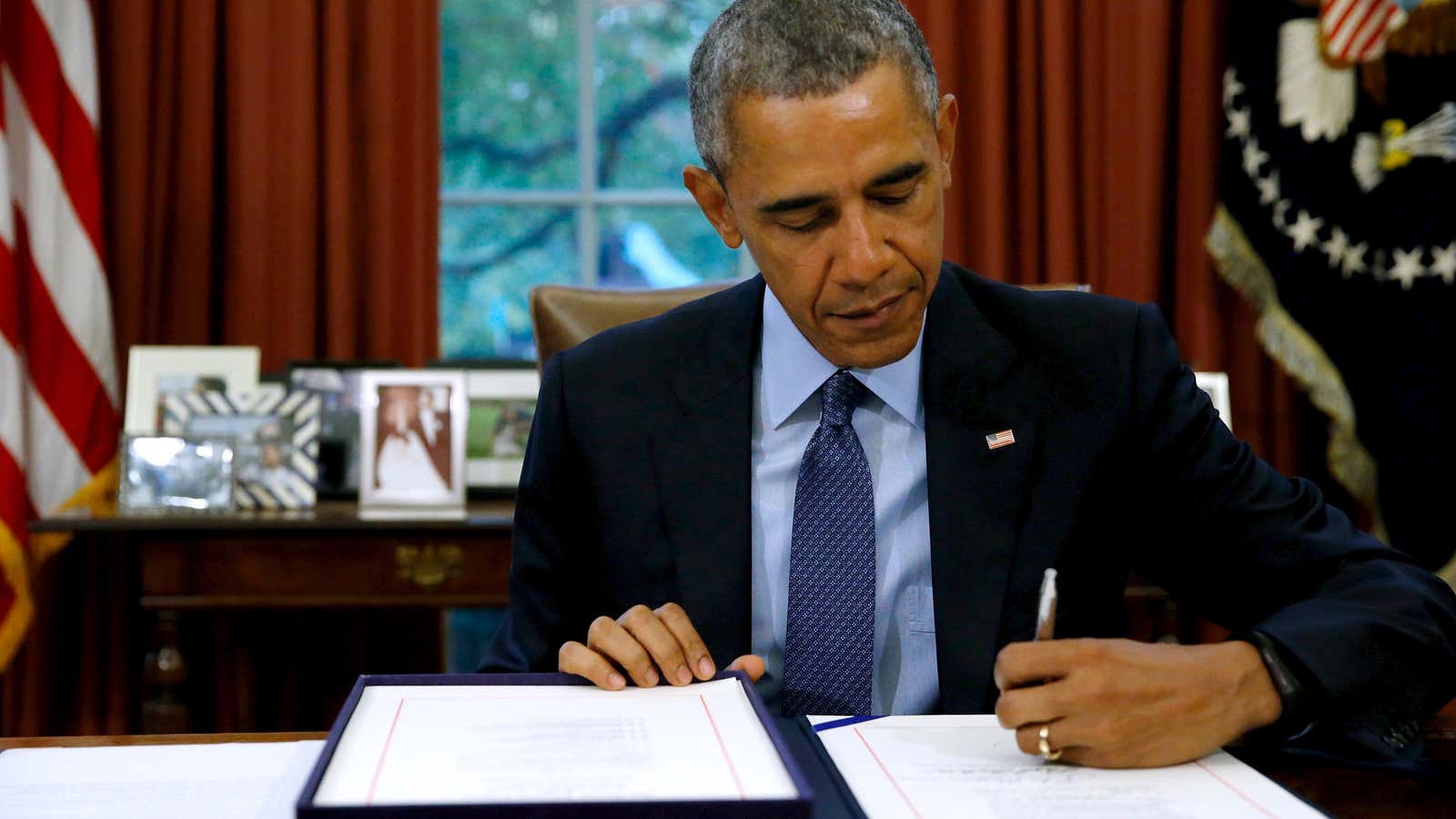 President Barack Obama signs the budget act of 2015 into law last November. A rare bipartisan agreement.
