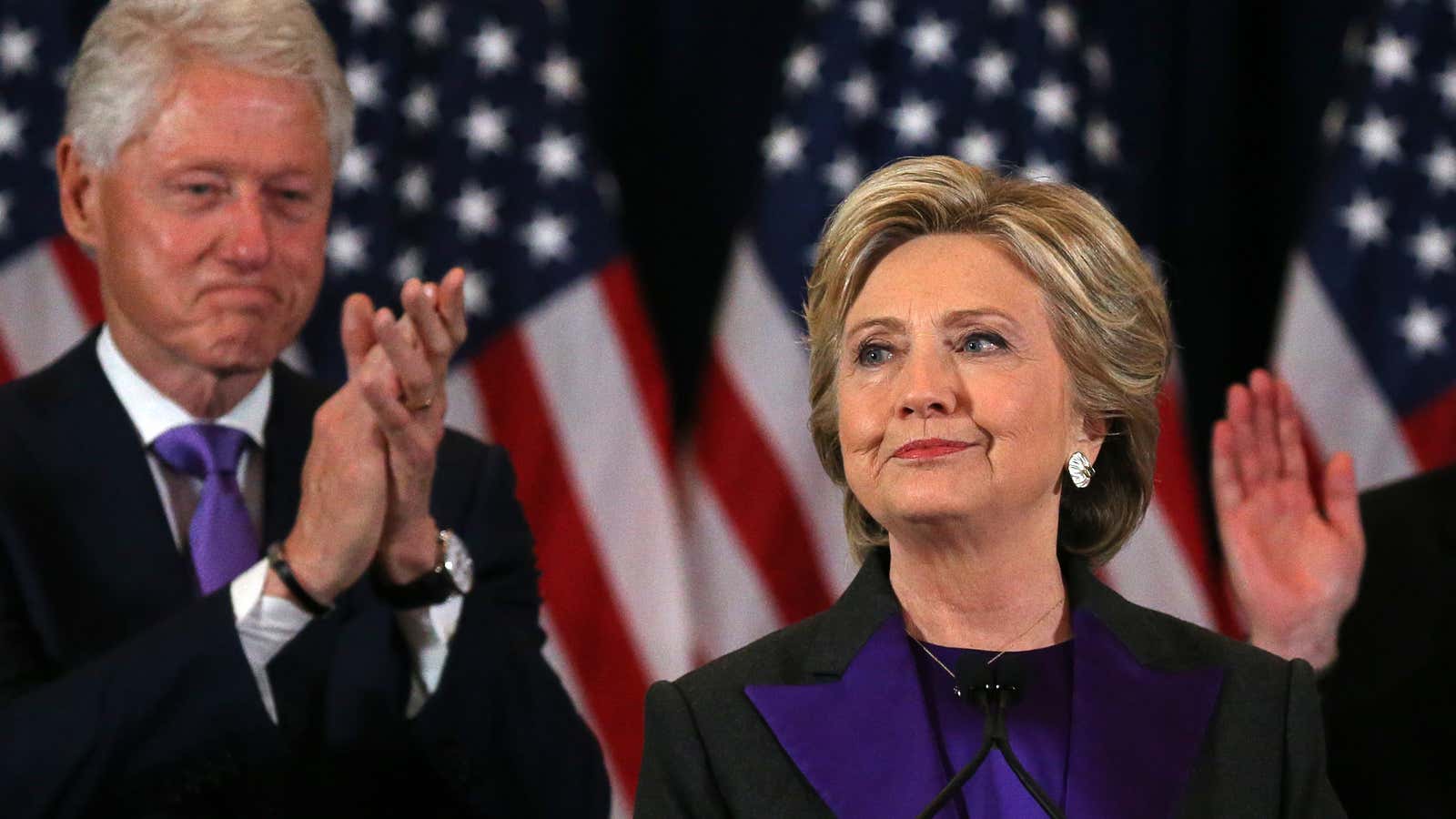 Democratic presidential candidate Hillary Clinton, with her husband, former U.S. President Bill Clinton receives applause at her concession speech.