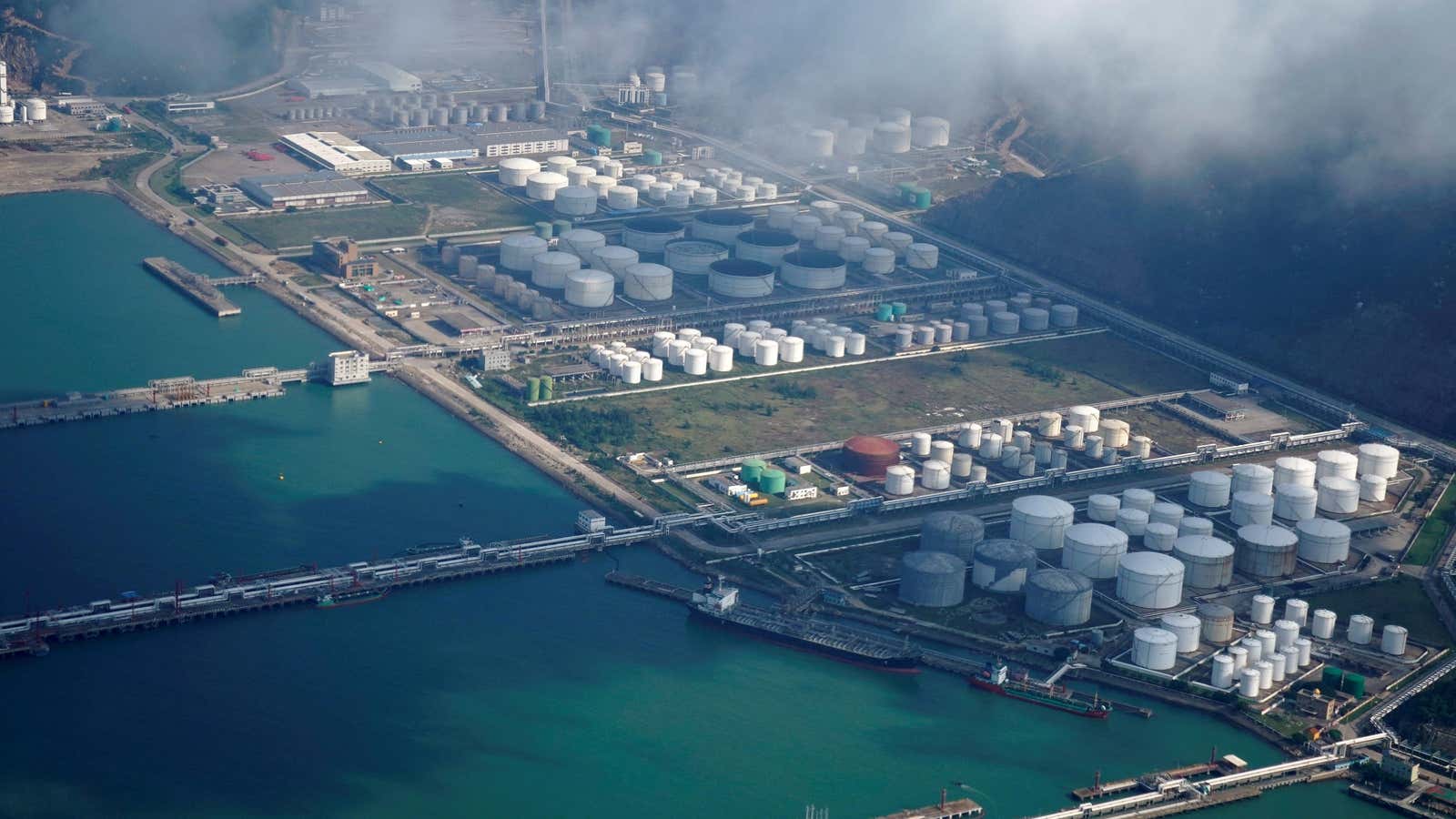 Oil and gas tanks are seen at an oil warehouse at a port in Zhuhai, China.