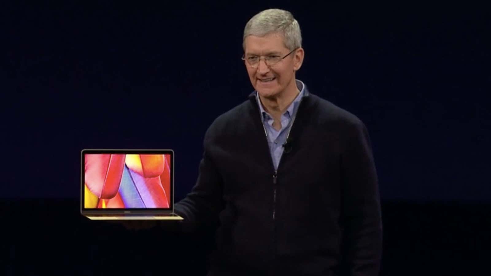 Tim Cook shows off Apple’s new MacBook.