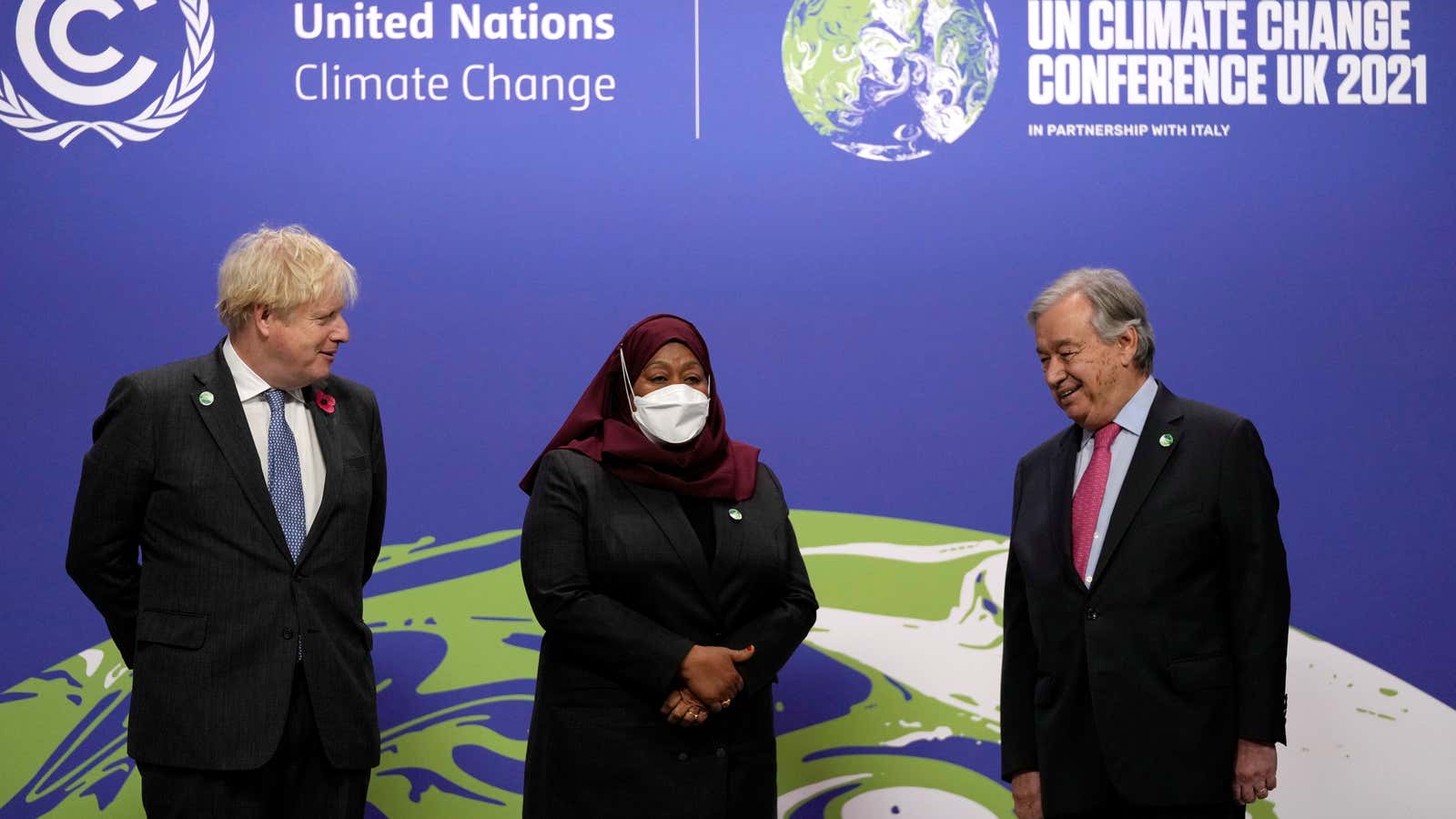 British Prime Minister Boris Johnson and United Nations Secretary General Antonio Guterres greet Tanzania’s President Samia Suluhu as she arrives for the UN Climate Change Conference (COP26) in Glasgow, Scotland, Britain