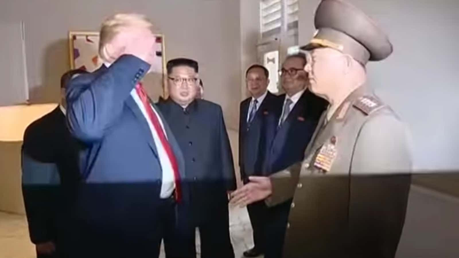 A handshake turning into a salute.