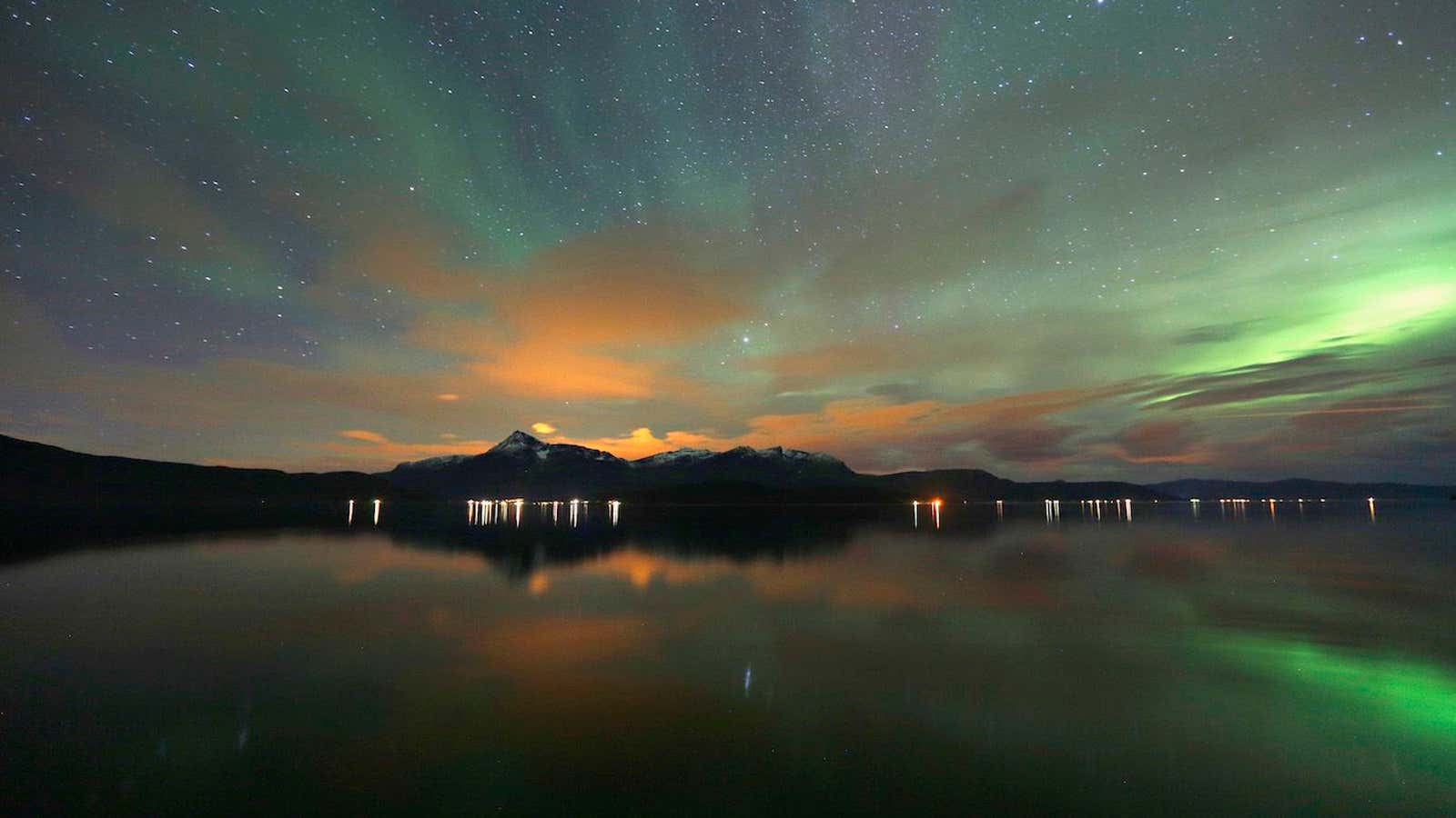 The Aurora Borealis (Northern Lights) is seen over the Bals-Fiord near the village of Mestervik, north of the Arctic Circle, early October 2, 2014. REUTERS/Yannis…