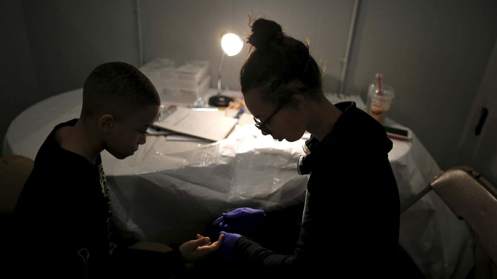 A boy at a clinic in Flint, Michigan, gets tested for lead poisoning in 2016.