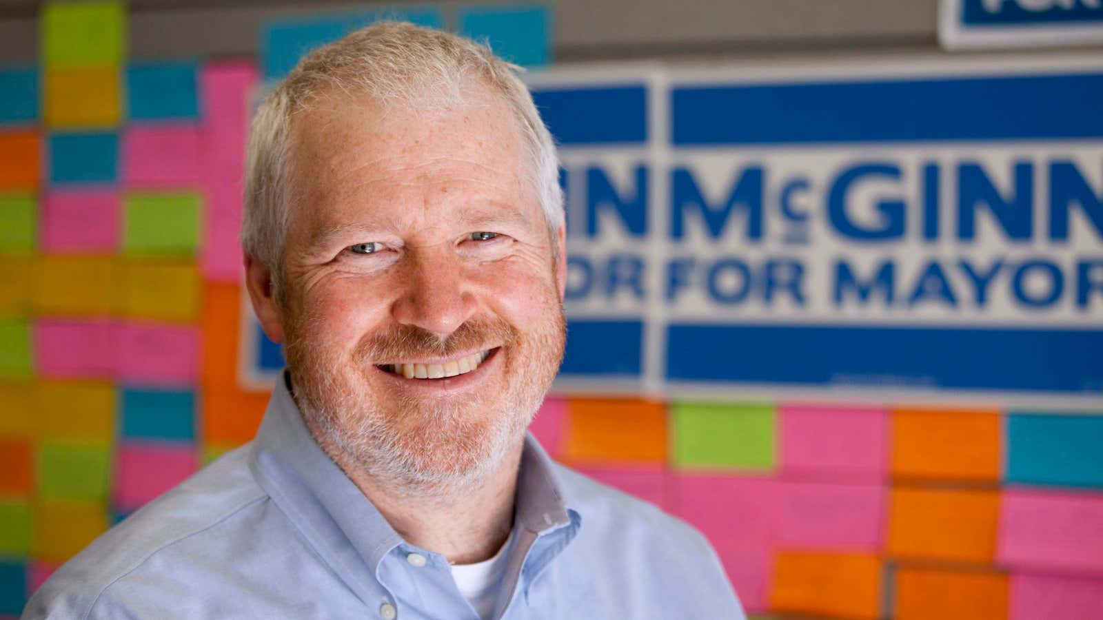 Comcast wants to wipe the smile off Seattle mayor Mike McGinn’s face.