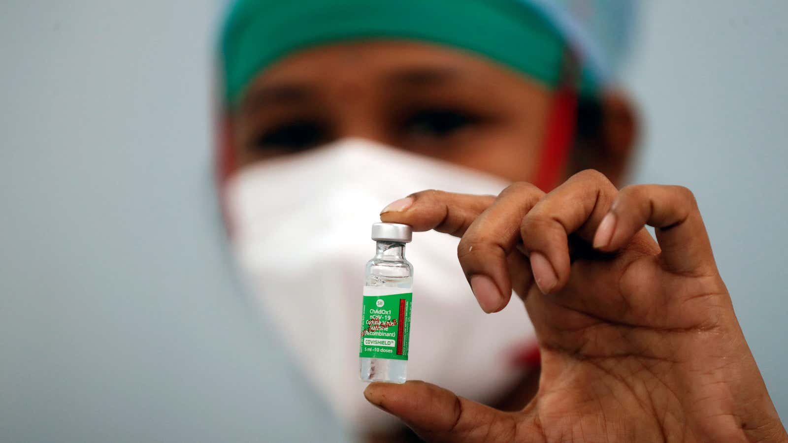 FILE PHOTO: A nurse displays a vial of COVISHIELD, the AstraZeneca COVID-19 vaccine manufactured by Serum Institute of India, at a medical centre in Mumbai,…