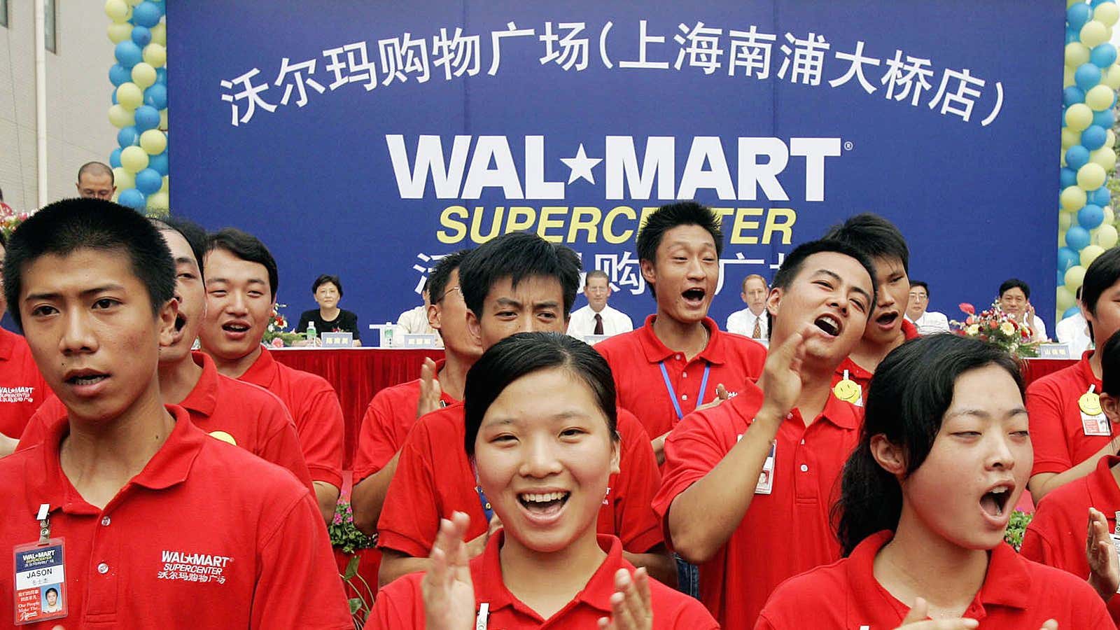 Workers at a 2005 Walmart opening event in Shanghai.