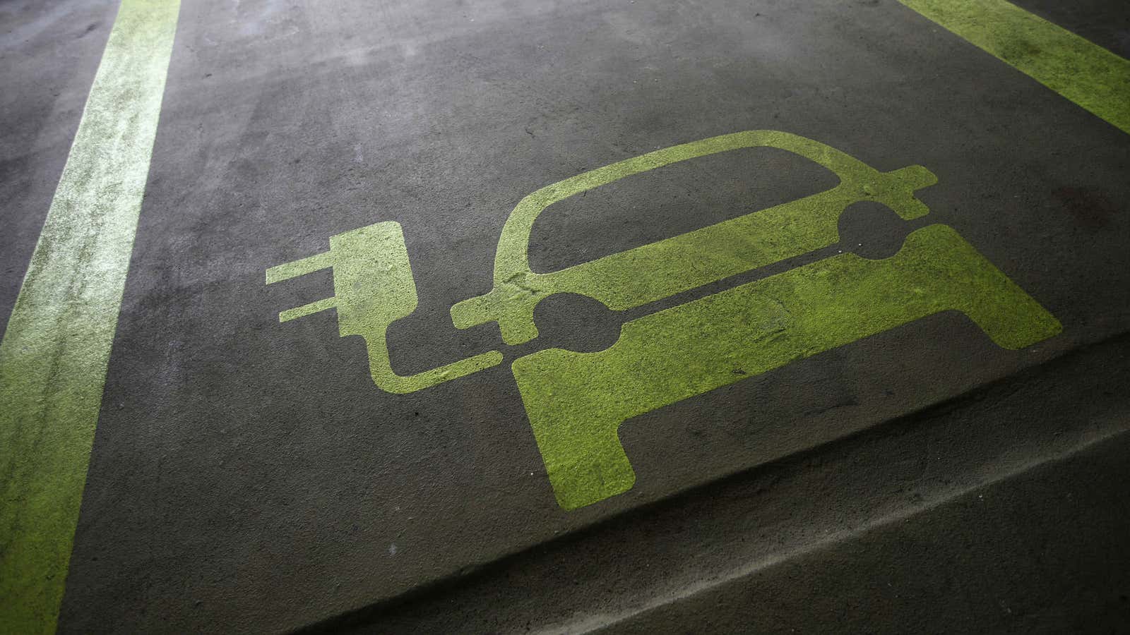 A sign is painted on a parking space for electric cars inside a car park in Hong Kong January 29, 2012. Many of the headlines…