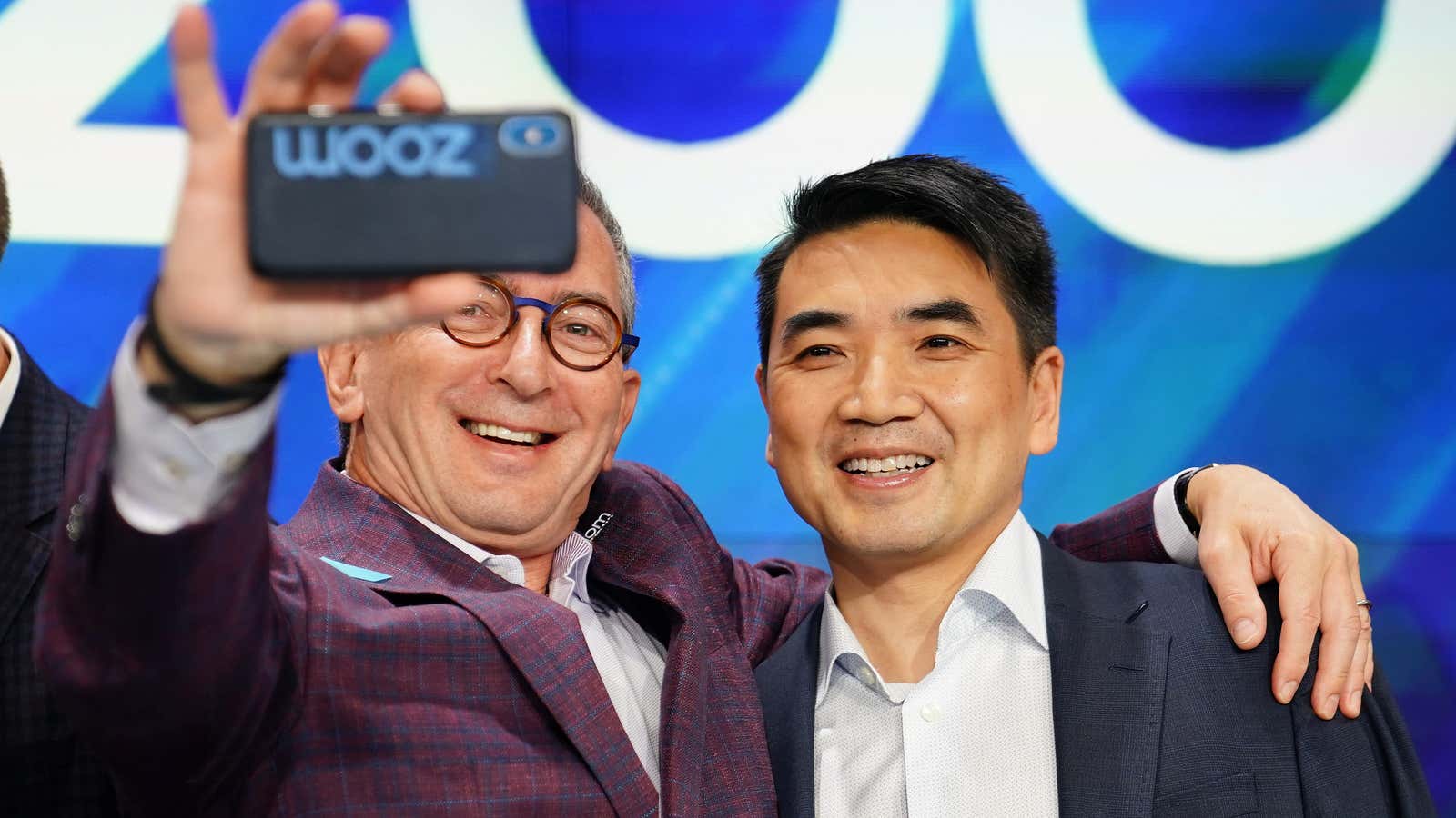 Zoom CEO Eric Yuan (right) takes the photo opp on Zoom’s IPO day.
