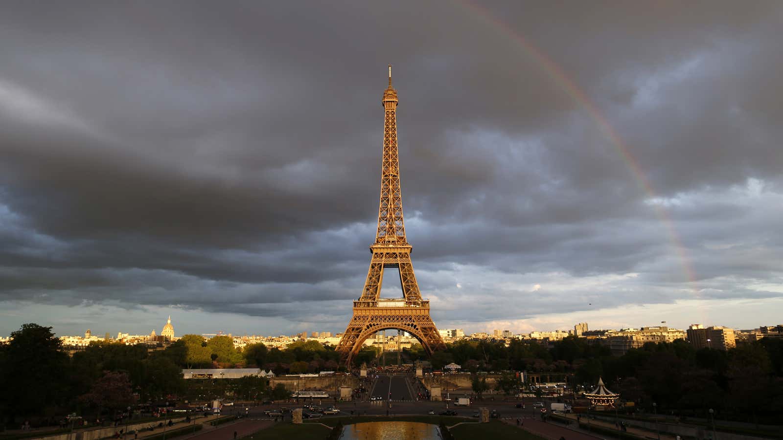 The iconic Eiffel Tower still beckons to strangers near and far.
