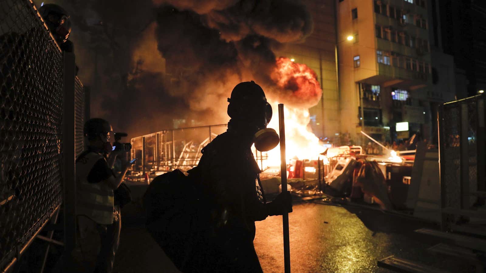 A fire set by protesters burns in Wan Chai during a pro-democracy protest.