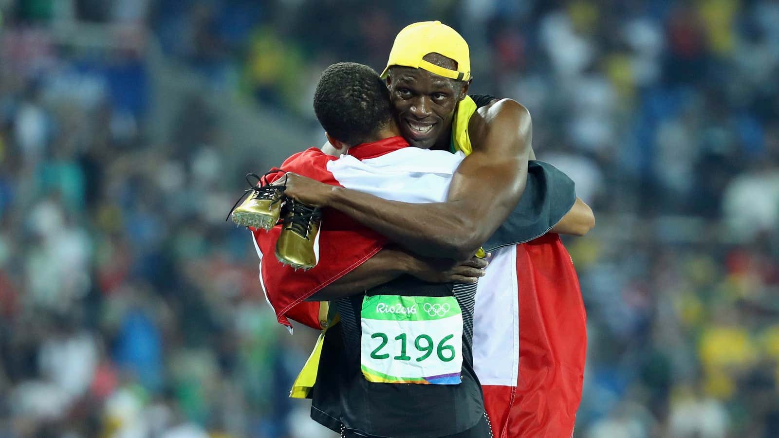 Bronze medallist Andre De Grasse of Canada hugs gold medallist Usain Bolt after the Men’s 100m Final—but the middle child is nowhere in sight.