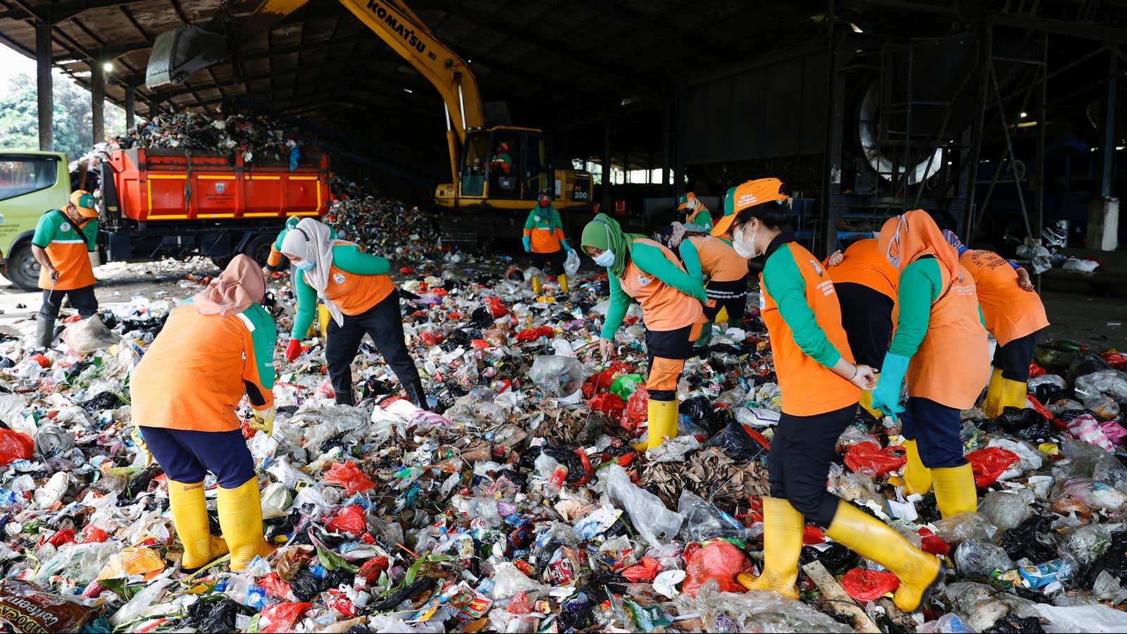 Workers sort the trash at Bantar Gebang landfill in Bekasi, West Java province, Indonesia, August 12, 2021.