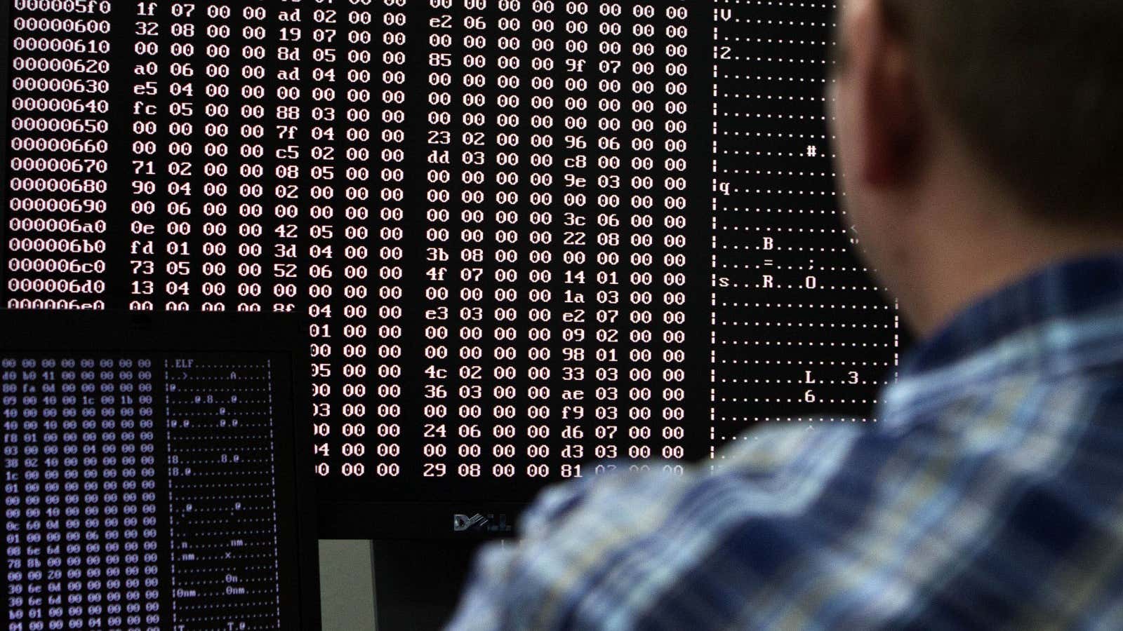 An analyst looks at code in the malware lab of a cyber security defense lab at the Idaho National Laboratory in Idaho Falls, Idaho September…