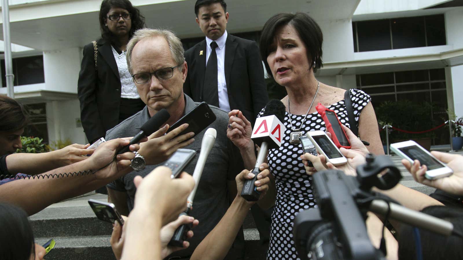 Mary and Rick Todd walk out of their son’s inquest in Singapore.