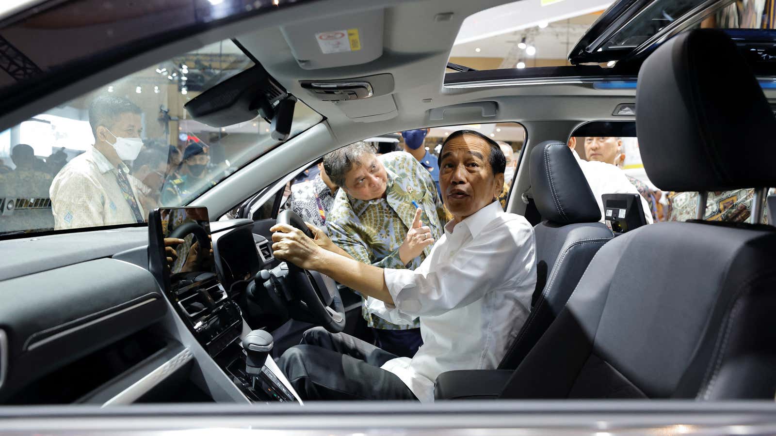 Indonesian president Joko Widodo at the wheel of the new Toyota Kijang Innova Zenix Hybrid EV car on Feb. 16, 2023.