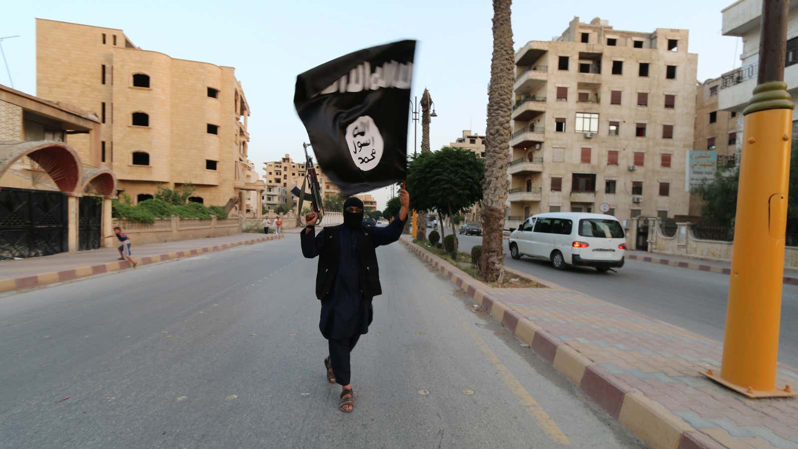 A fighter for the Islamic State parades down a street in Raqqa, the proclaimed capital.