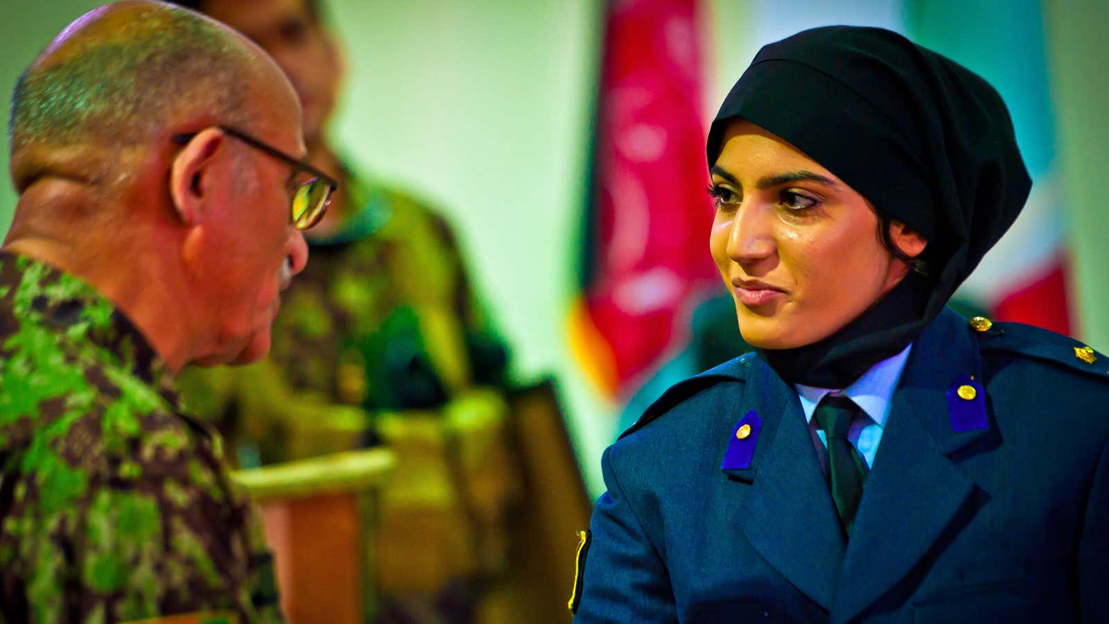 Niloofar Rhmani accepts her pilot wings at a ceremony May 14, 2013, at Shindand Air Base, Afghanistan. (U.S. Air Force photo/Scott Saldukas)