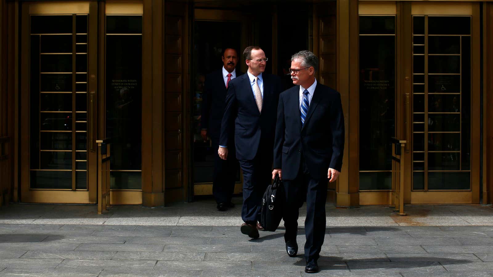 SAC Capital Advisors’ defense attorneys leave federal court in New York.