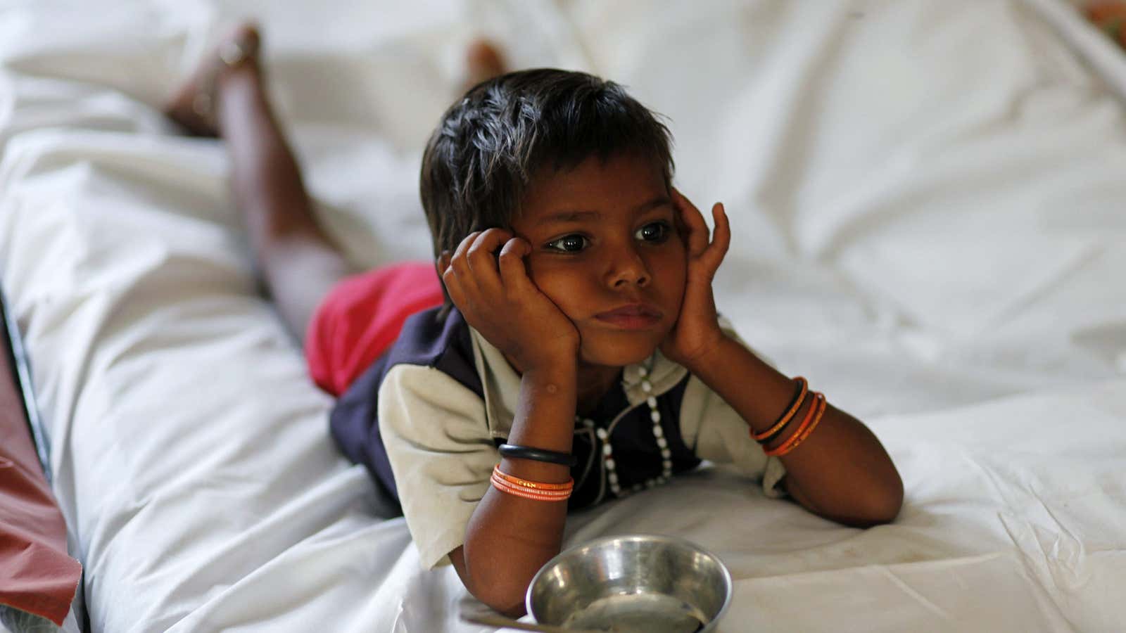 A malnourished child waits for food at the Nutritional Rehabilitation Centre in Sheopur district in the central Indian state of Madhya Pradesh April 6, 2010.…