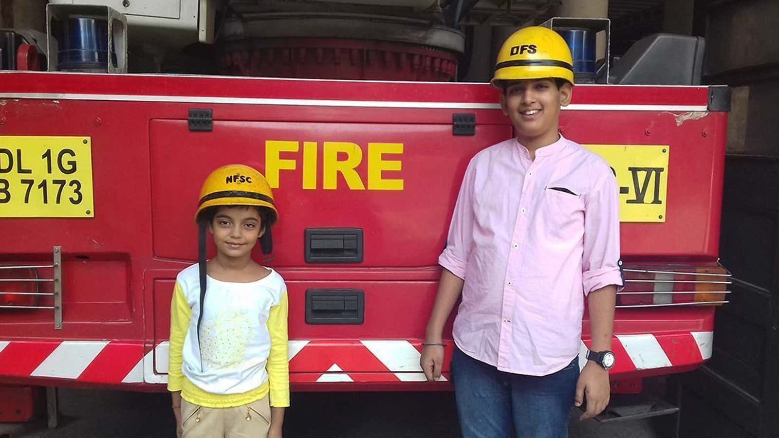 Children of firemen celebrate Diwali at the Connaught Place fire station in New Delhi.