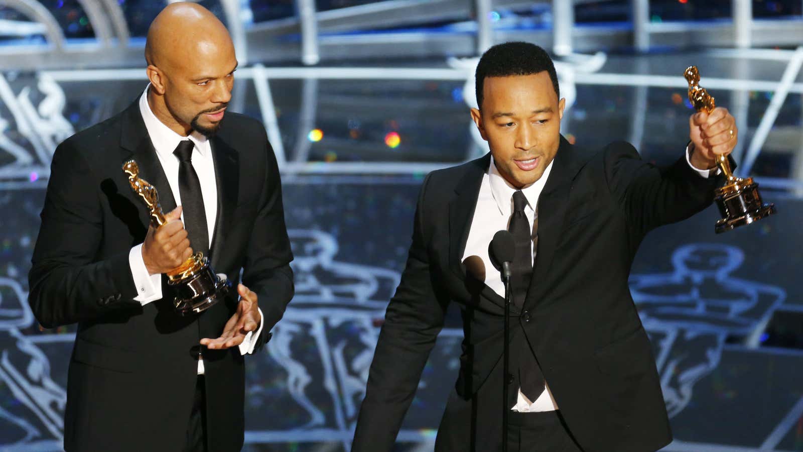 Common (left) and John Legend celebrate their win.