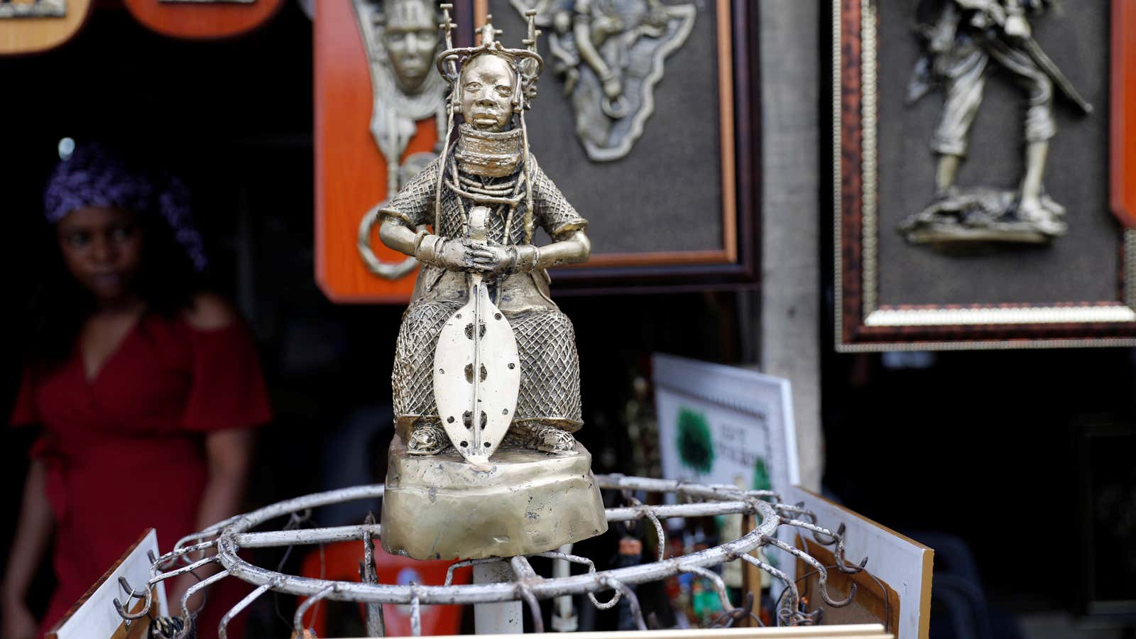A bronze work is displayed for sale in front of a shop in Benin City, Edo state, Nigeria
