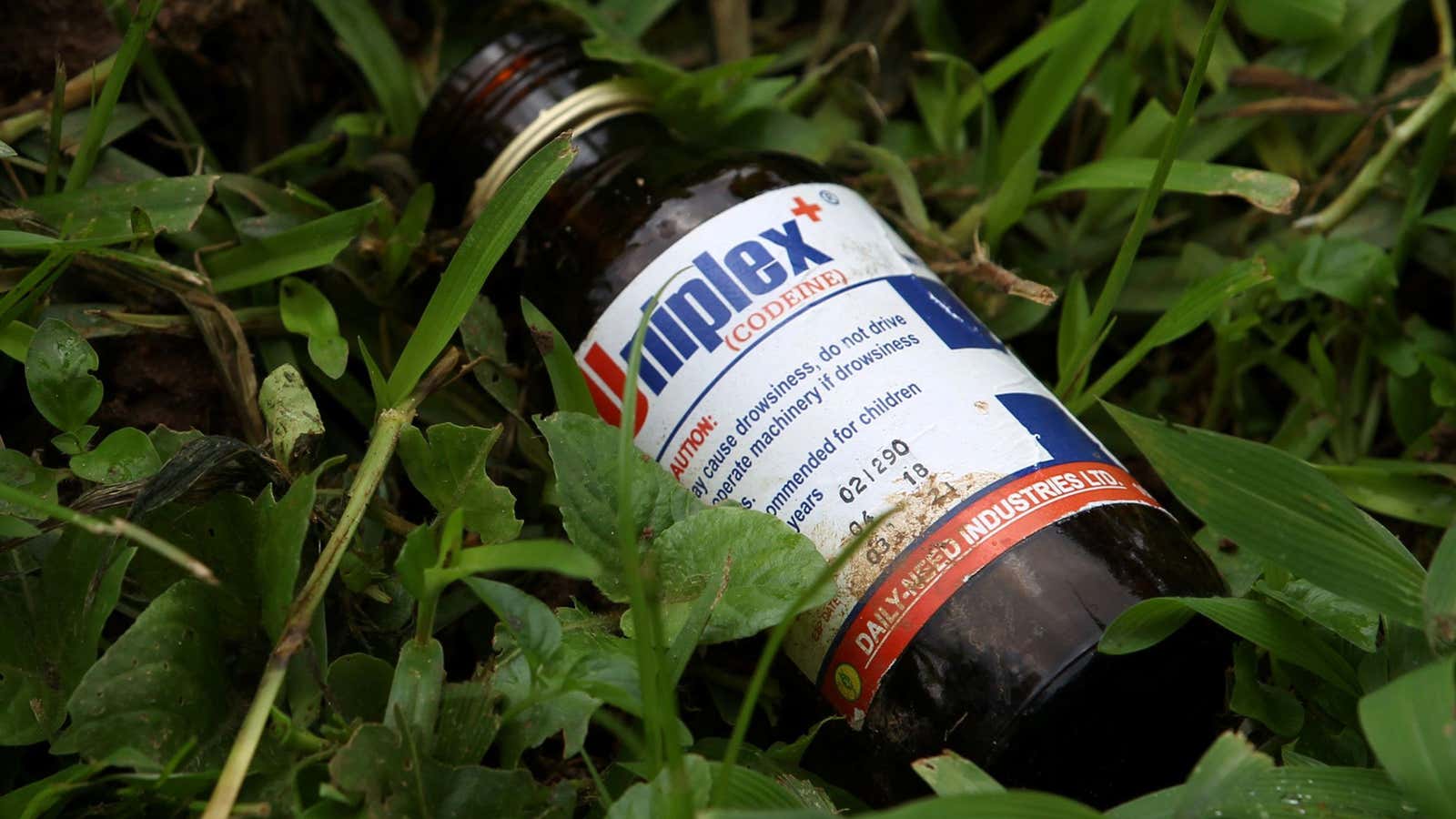An empty bottle of Uniplex syrup, containing codeine, a common drug of choice for Nigerian youth