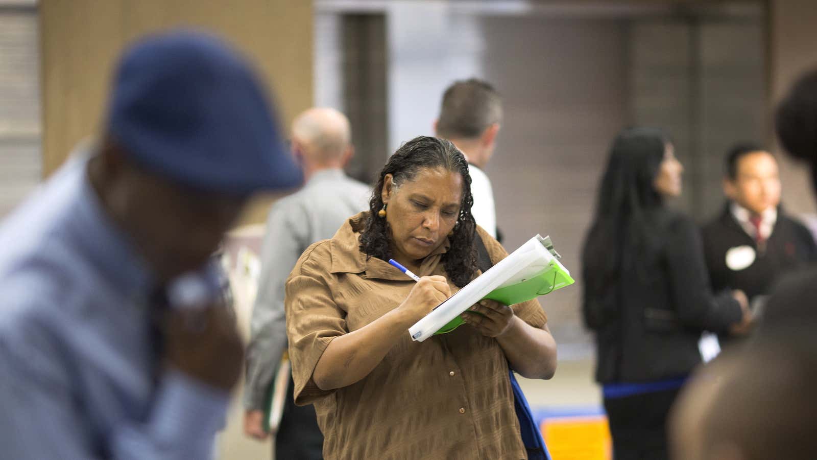 Malana Long fills out a job application during a job fair in Los Angeles.