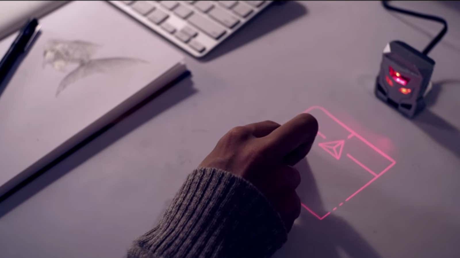Awesome laser makes your mouse obsolete by projecting a trackpad on your desk