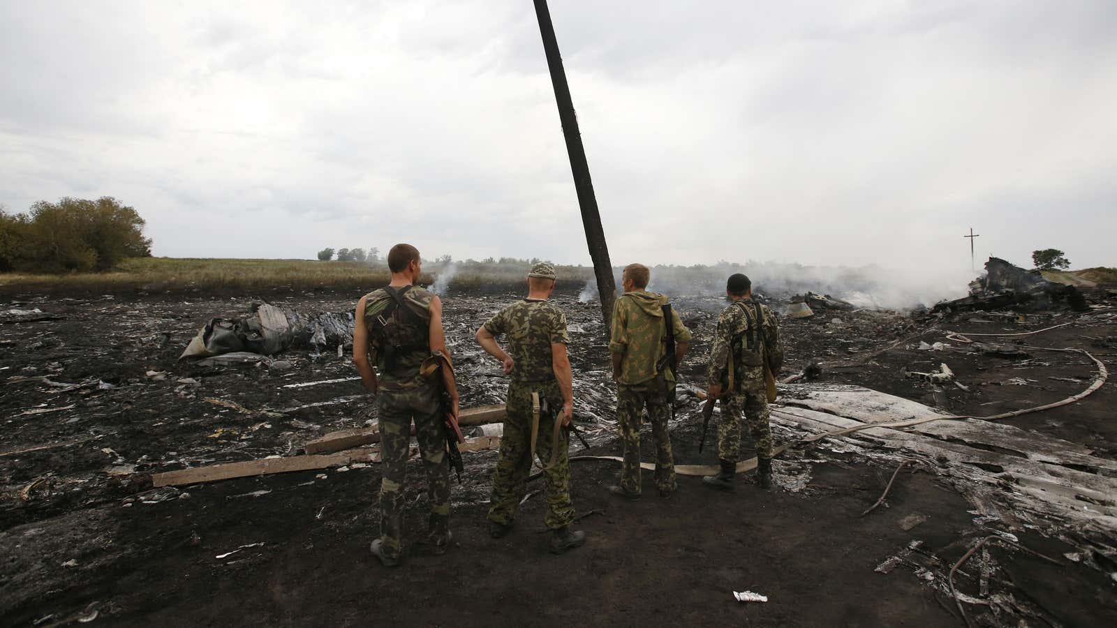Pro-Russian separatists at the site of the crash.