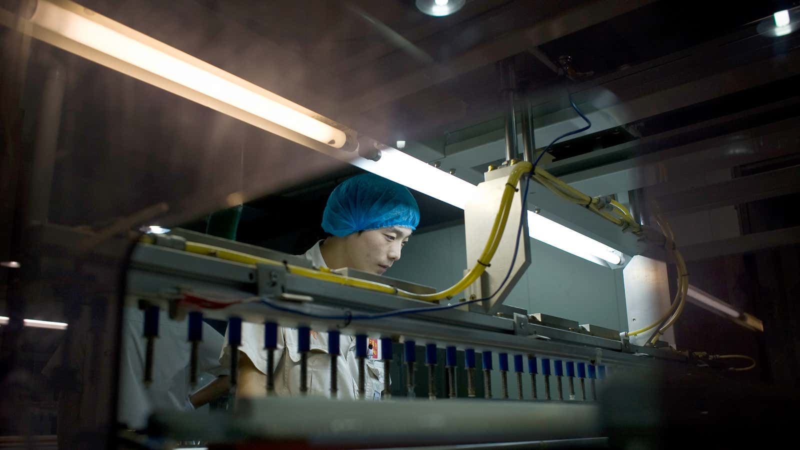 A worker at Yingli Green Energy makes solar panels in Baoding, China. The US government says those panels are subsidized and then dumped into US markets.