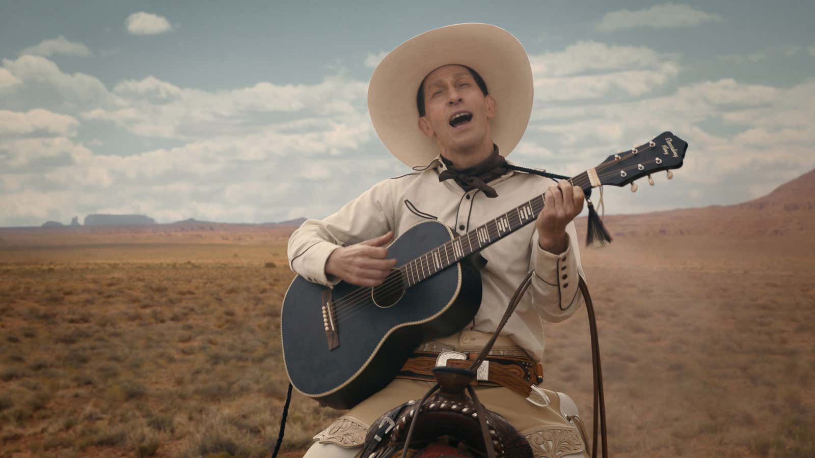 Don’t let his crooning fool you—Buster Scruggs is an agent of death.