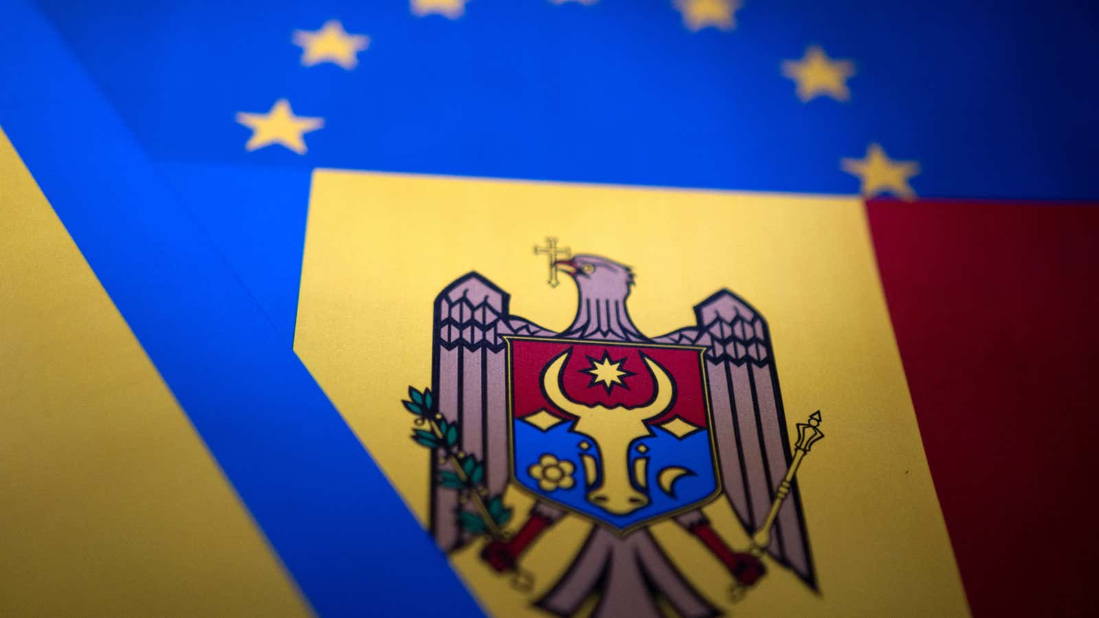 The flags of the EU, Ukraine, and Moldova.
