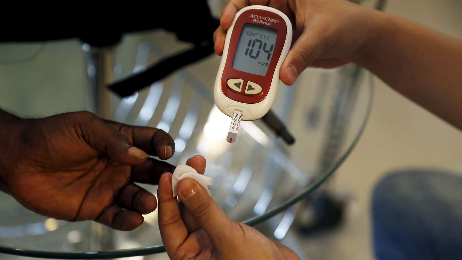 Checking on a diabetic patient’s blood sugar level