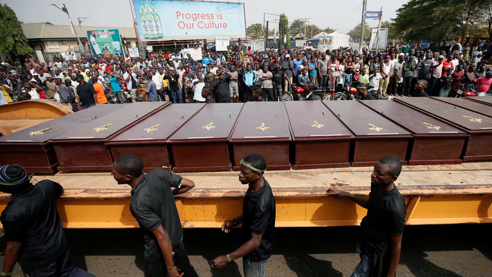 Men march alongside the truck carrying the coffins of people killed by the Fulani herdsmen, in Makurdi, Nigeria in January.