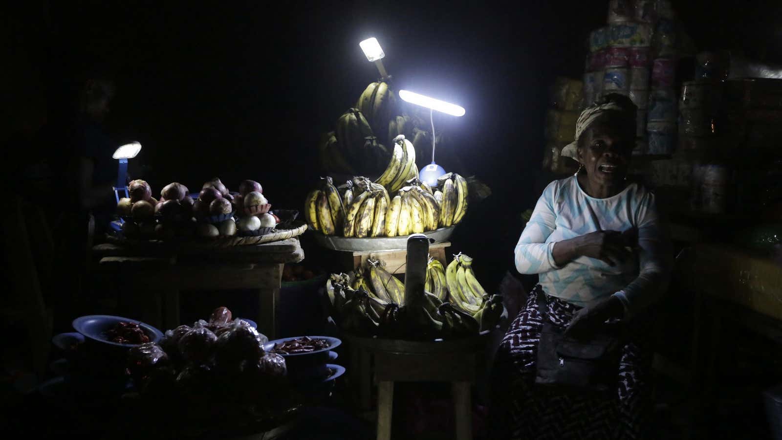Lagos vegetable vendors ply their wares by solar lanterns in Nigeria