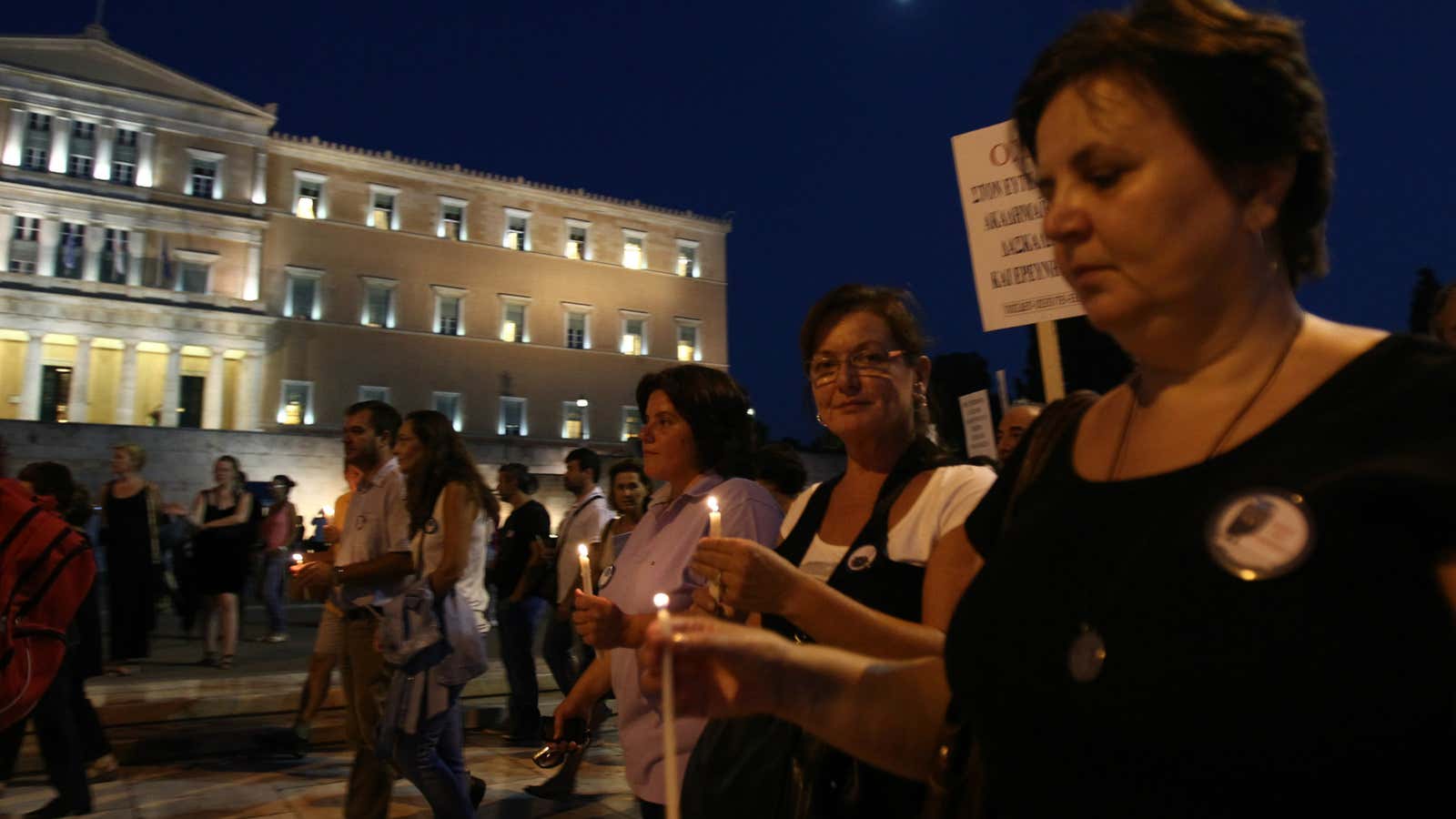 Professors protest austerity measures at the Greek parliament.