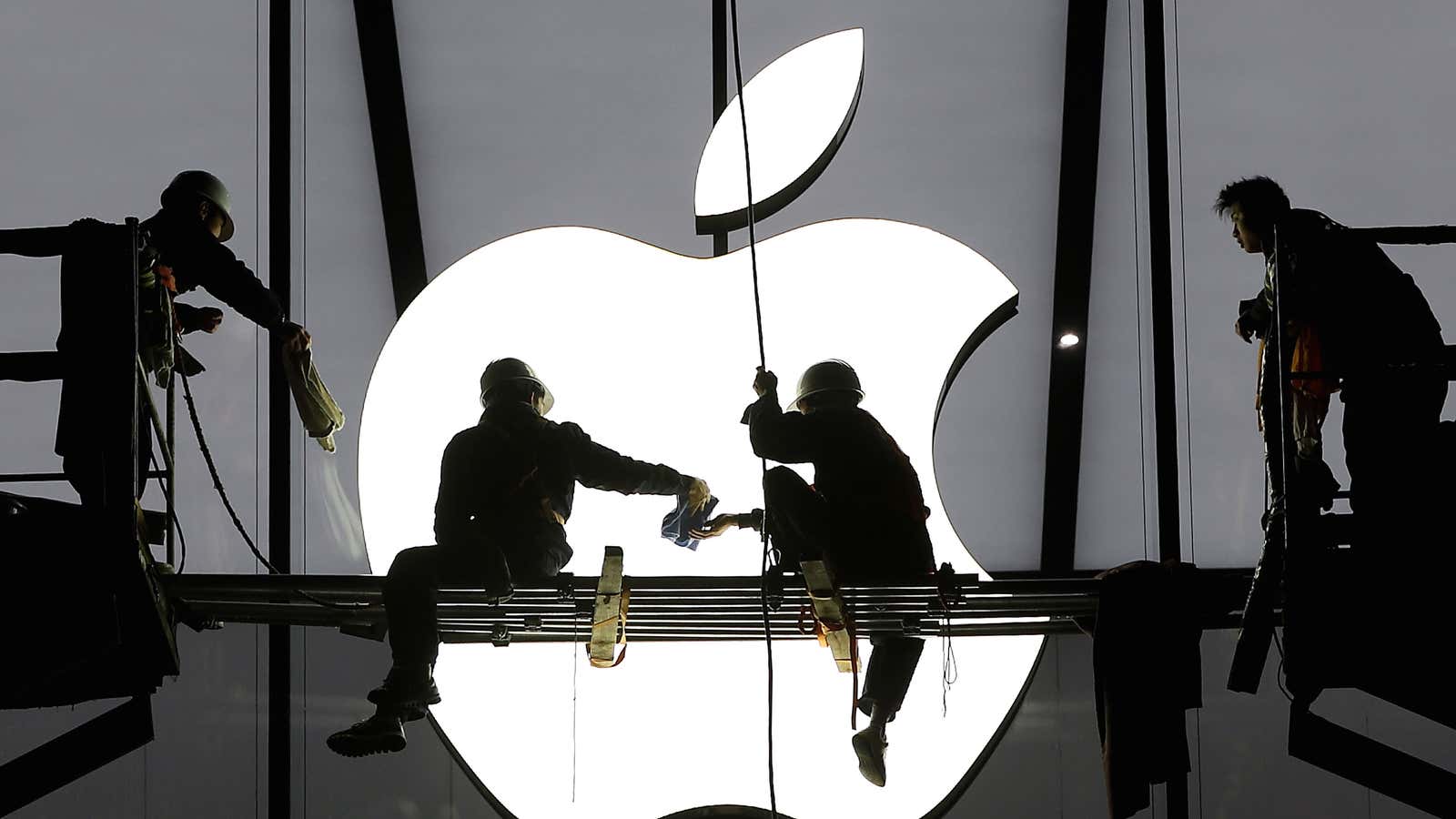 Workers prepare for the opening of an Apple store in Hangzhou, Zhejiang province.