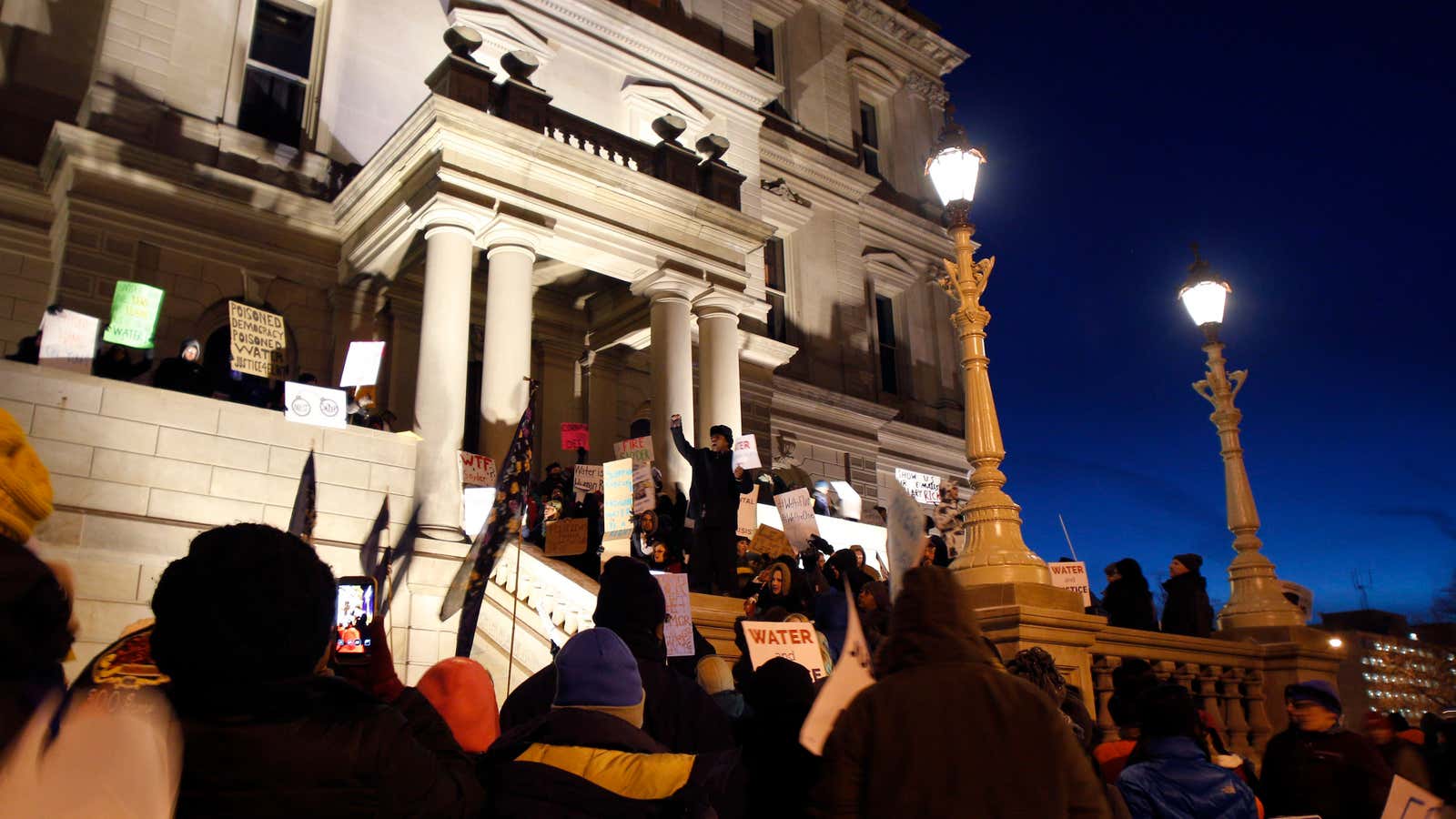 Protesters gather outside Michigan’s capitol building.