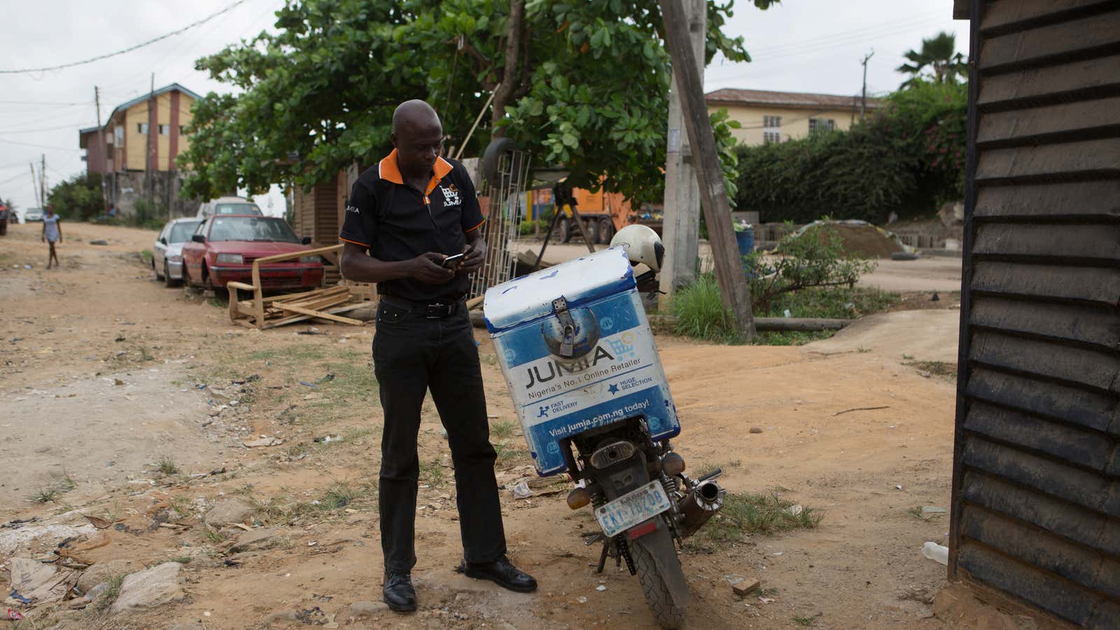 Moses Udoh, an employee of online retailer Jumia, makes a delivery by motorcycle in Lagos February 16, 2015. The growth of Africa’s middle class has…