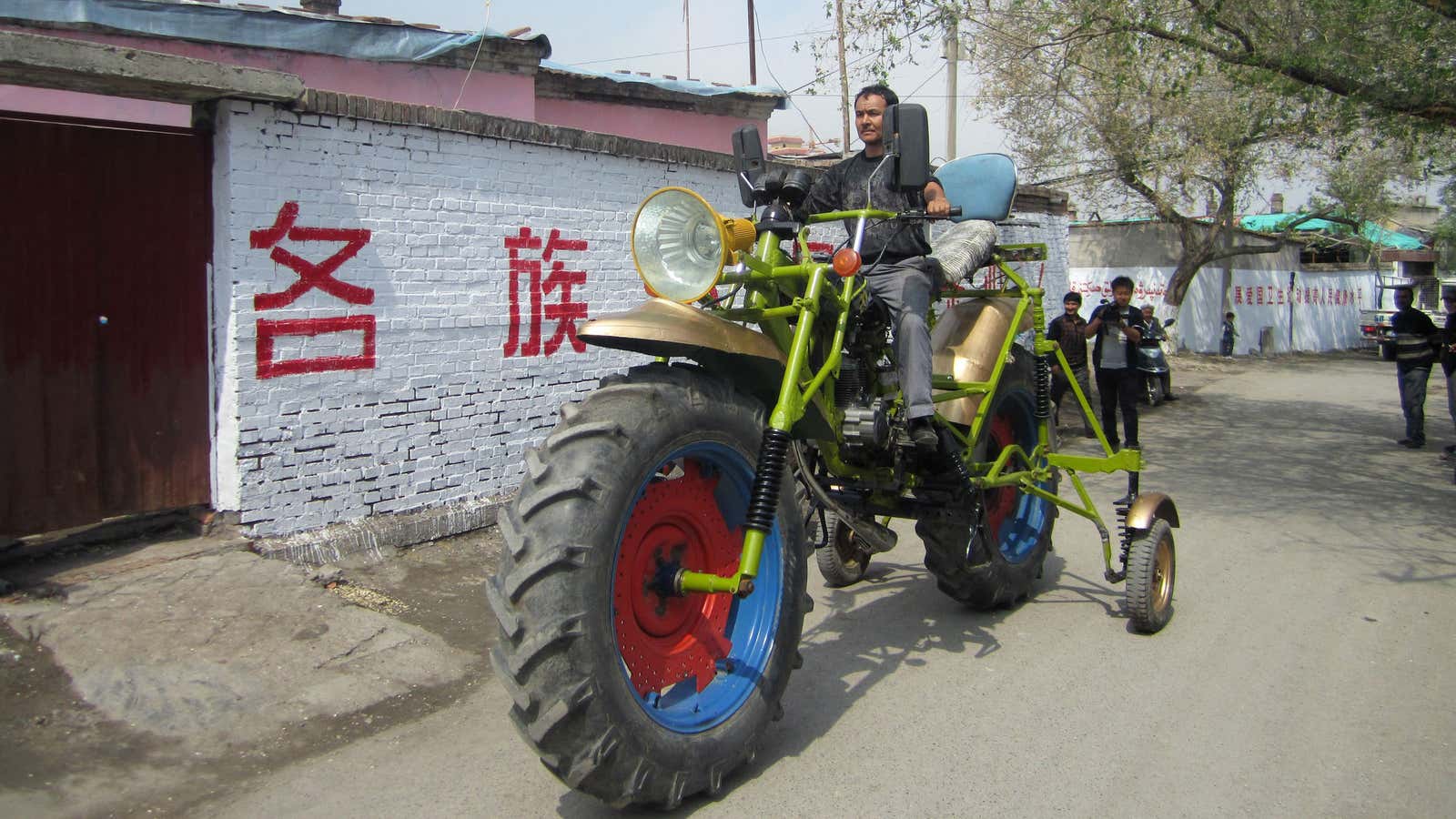 A man in Manas county, in Xinjiang, drives a motorcycle he made from scrap parts and a second-hand engine.