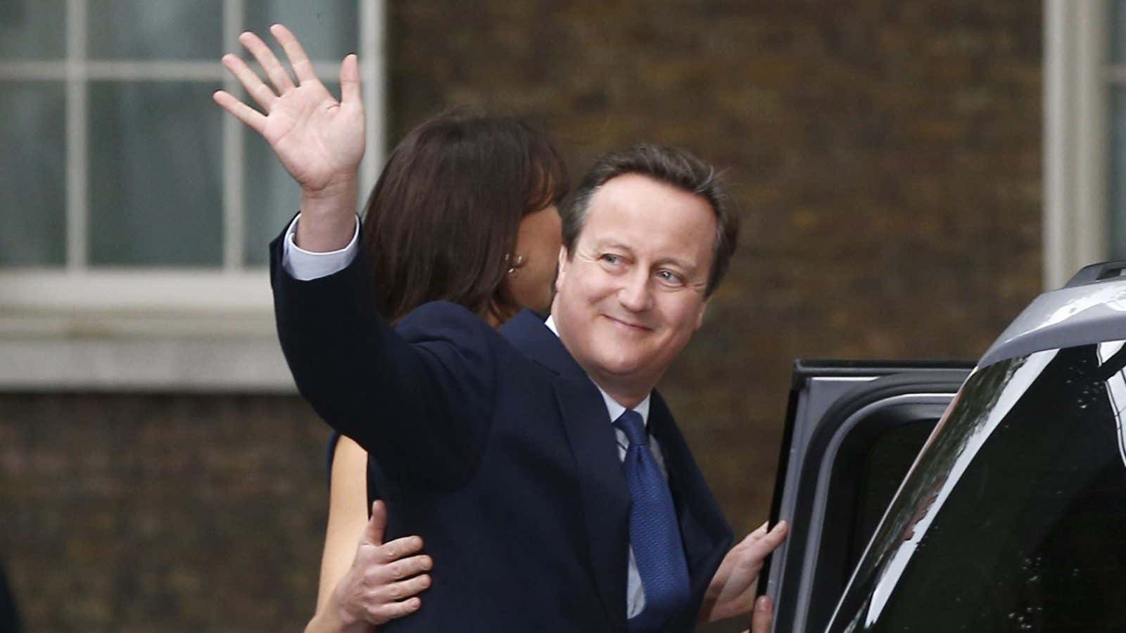 Britain’s outgoing Prime Minister, David Cameron with his wife Samantha, waves in front of number 10 Downing Street, on his last day in office as…