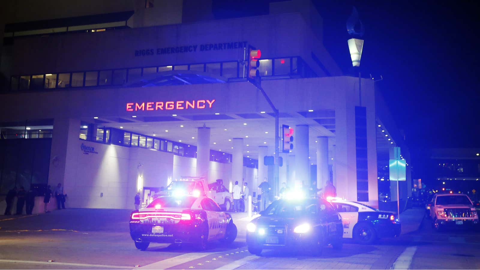 Emergency responder vehicles sit outside of the emergency room at Baylor University Medical Center.