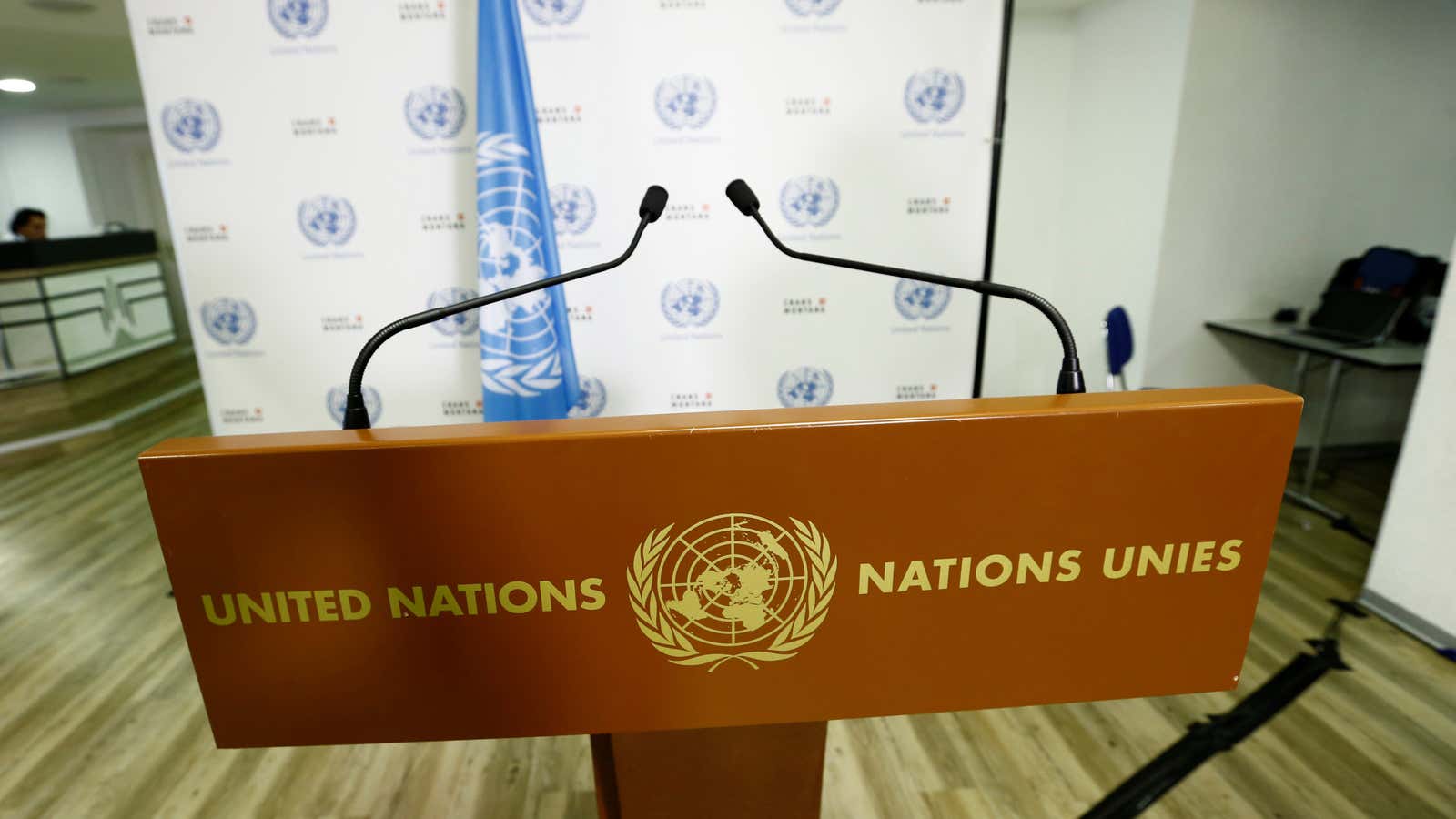 The United Nations logo is pictured on a podium before a news conference in the Alpine resort of Crans-Montana, Switzerland, June 28, 2017. REUTERS/Denis Balibouse
