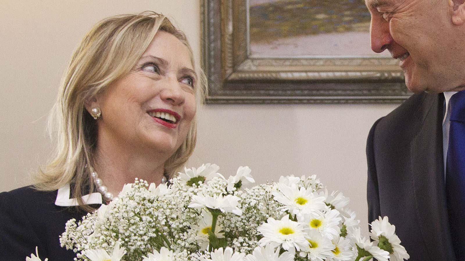 Hillary Clinton receives yet another gift of flowers.