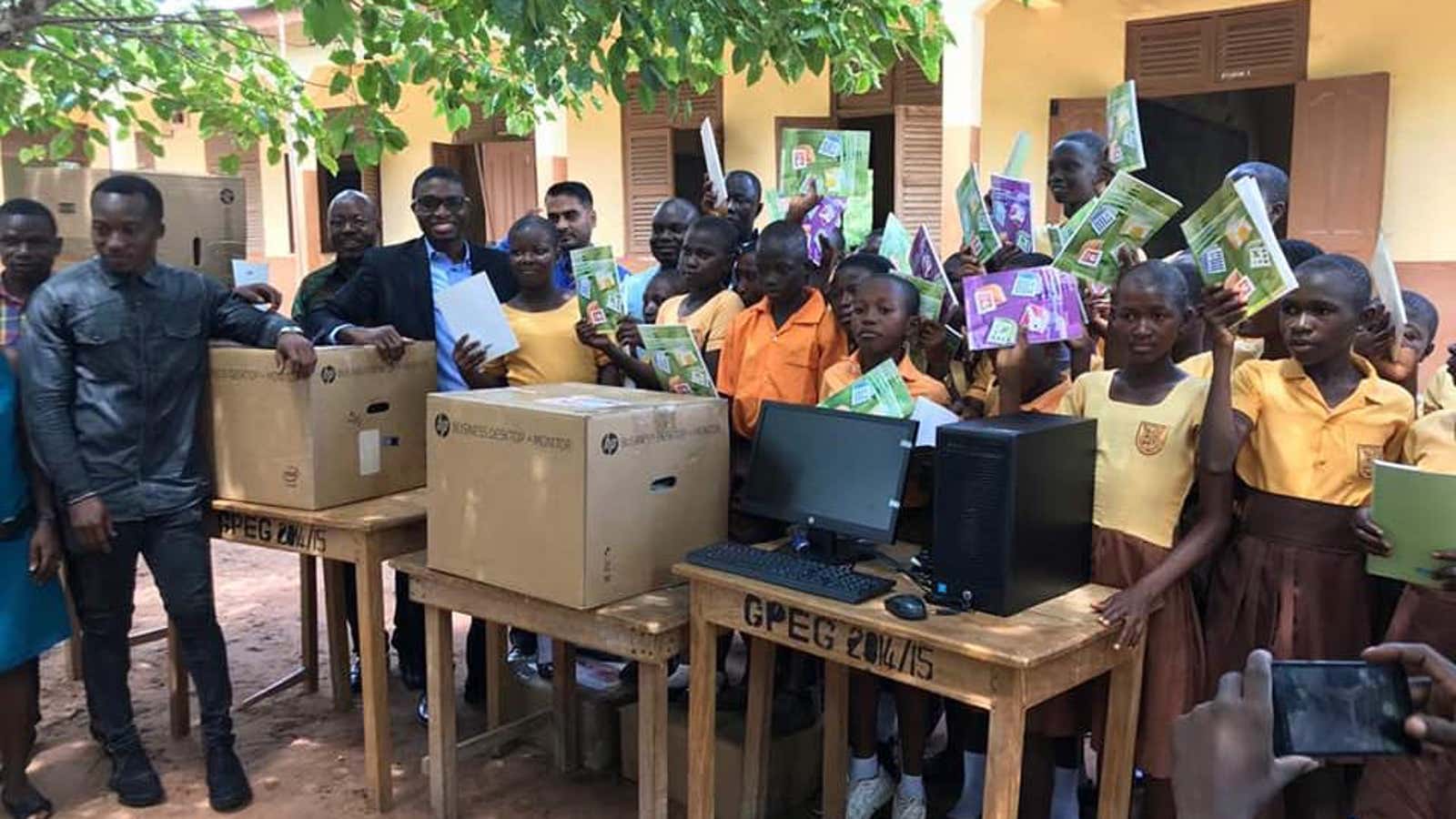The students receive gifts of five computers.
