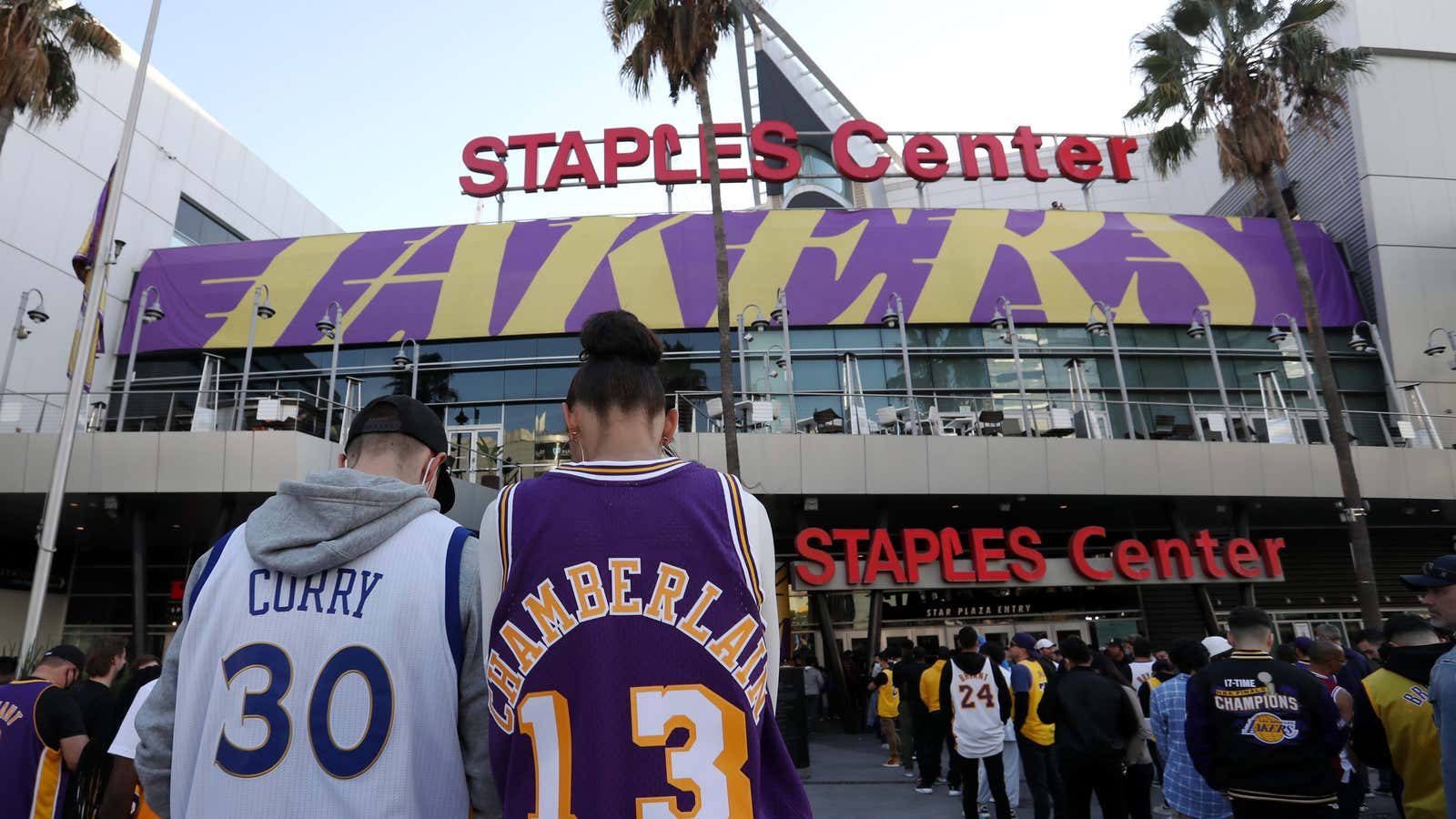 Fans arrive at the Staples Center in LA