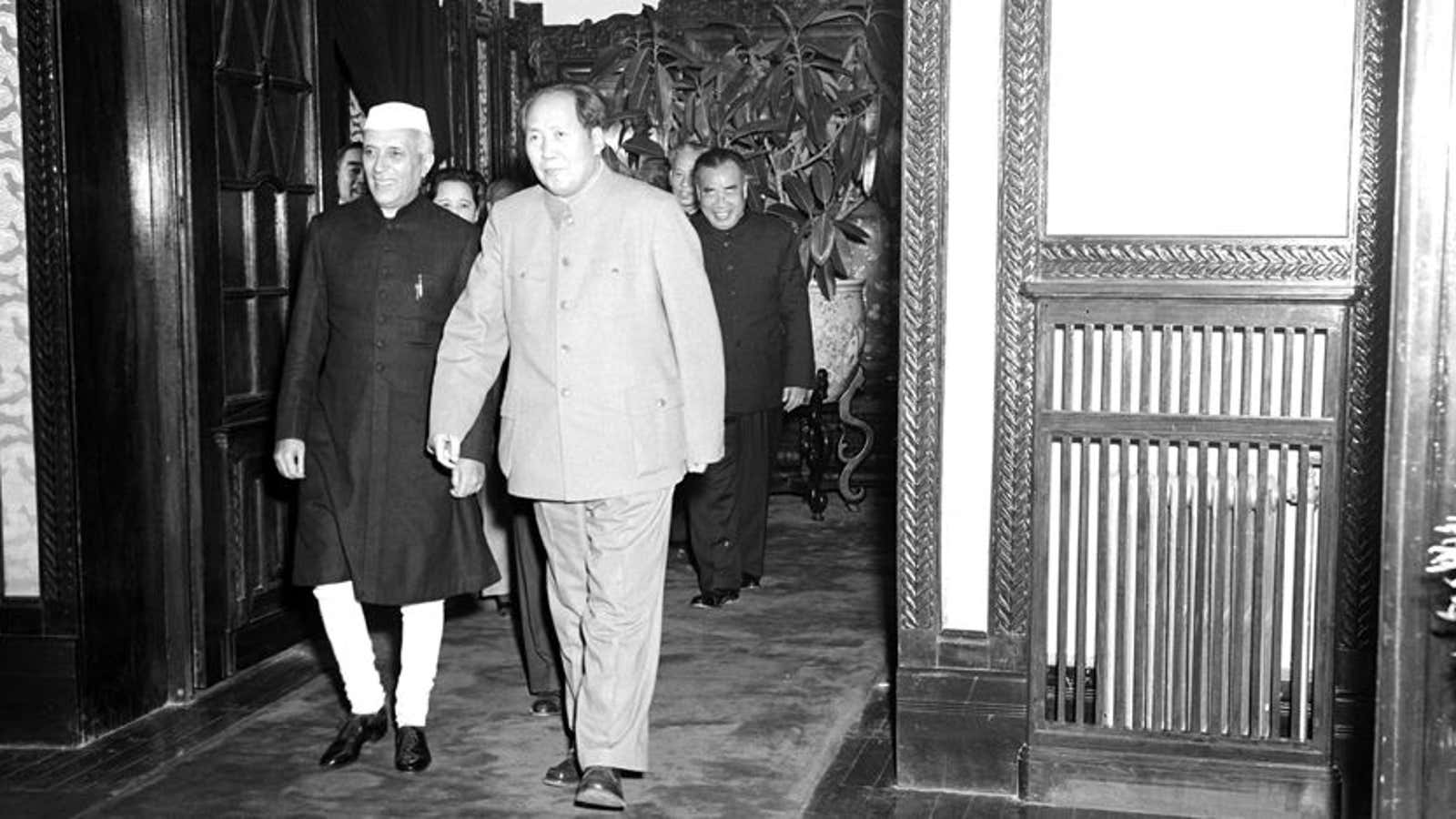 Jawaharlal Nehru being led to a banquet hall by Mao Zedong.