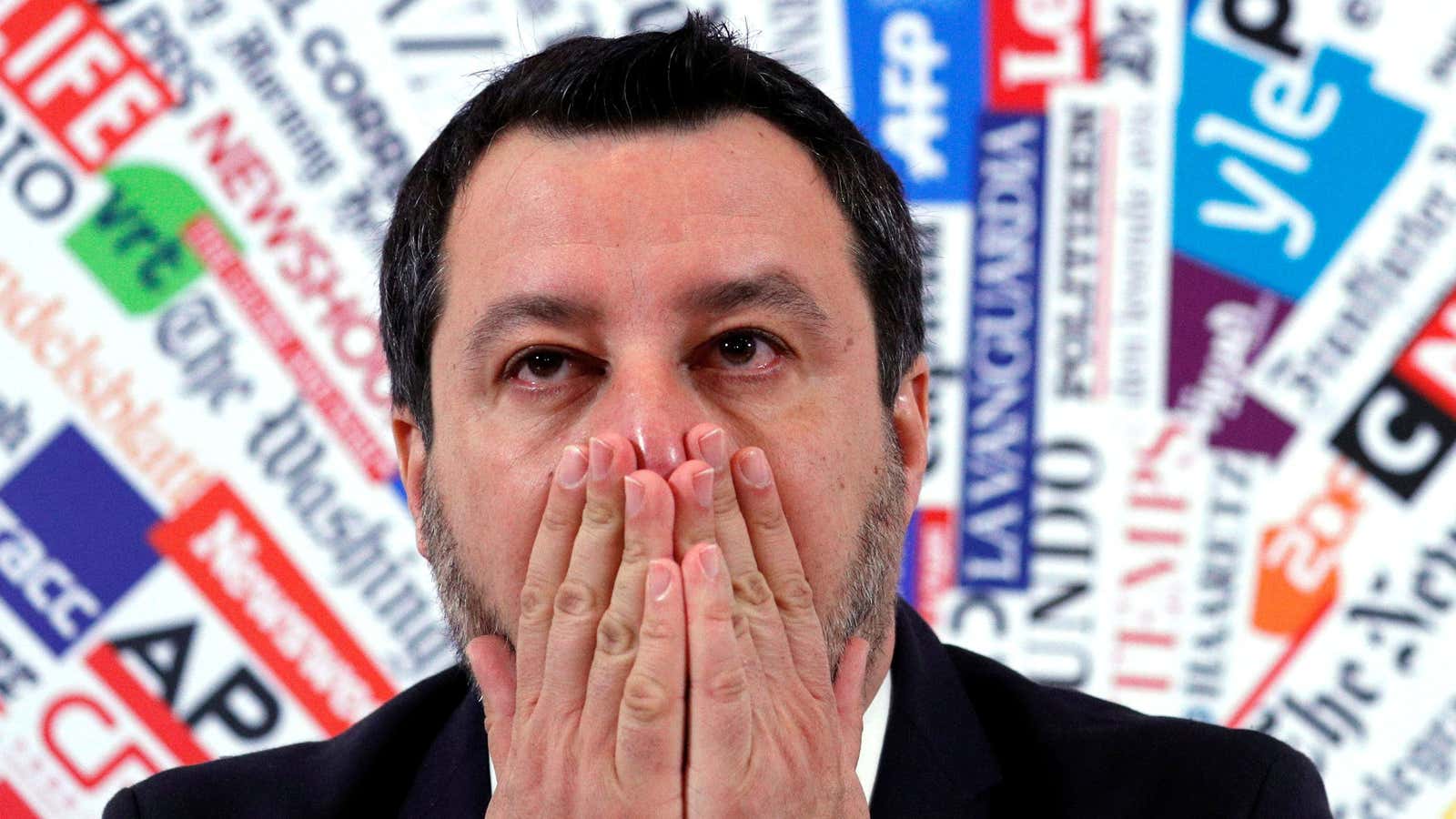Italy’s far-right party leader Matteo Salvini touches his face.